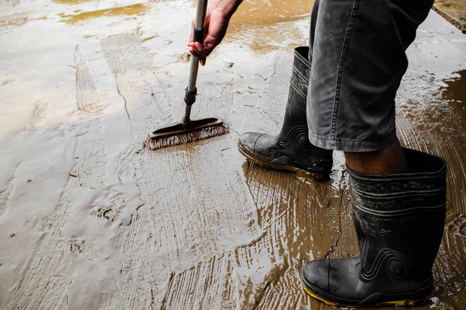 Work boots standing on a bare concrete slab