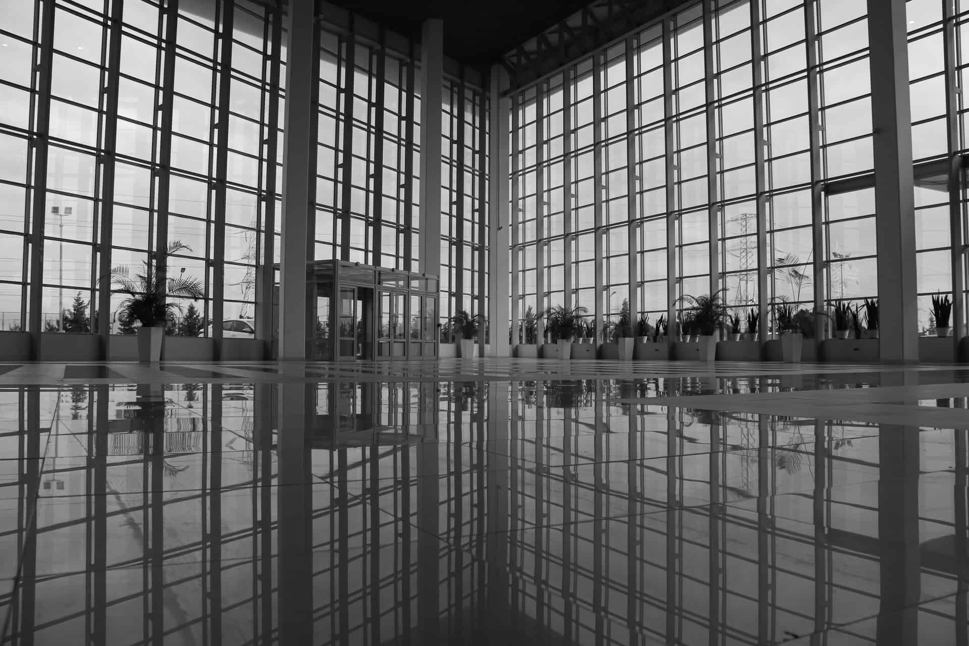 A wet polished floor reflecting overhead lights
