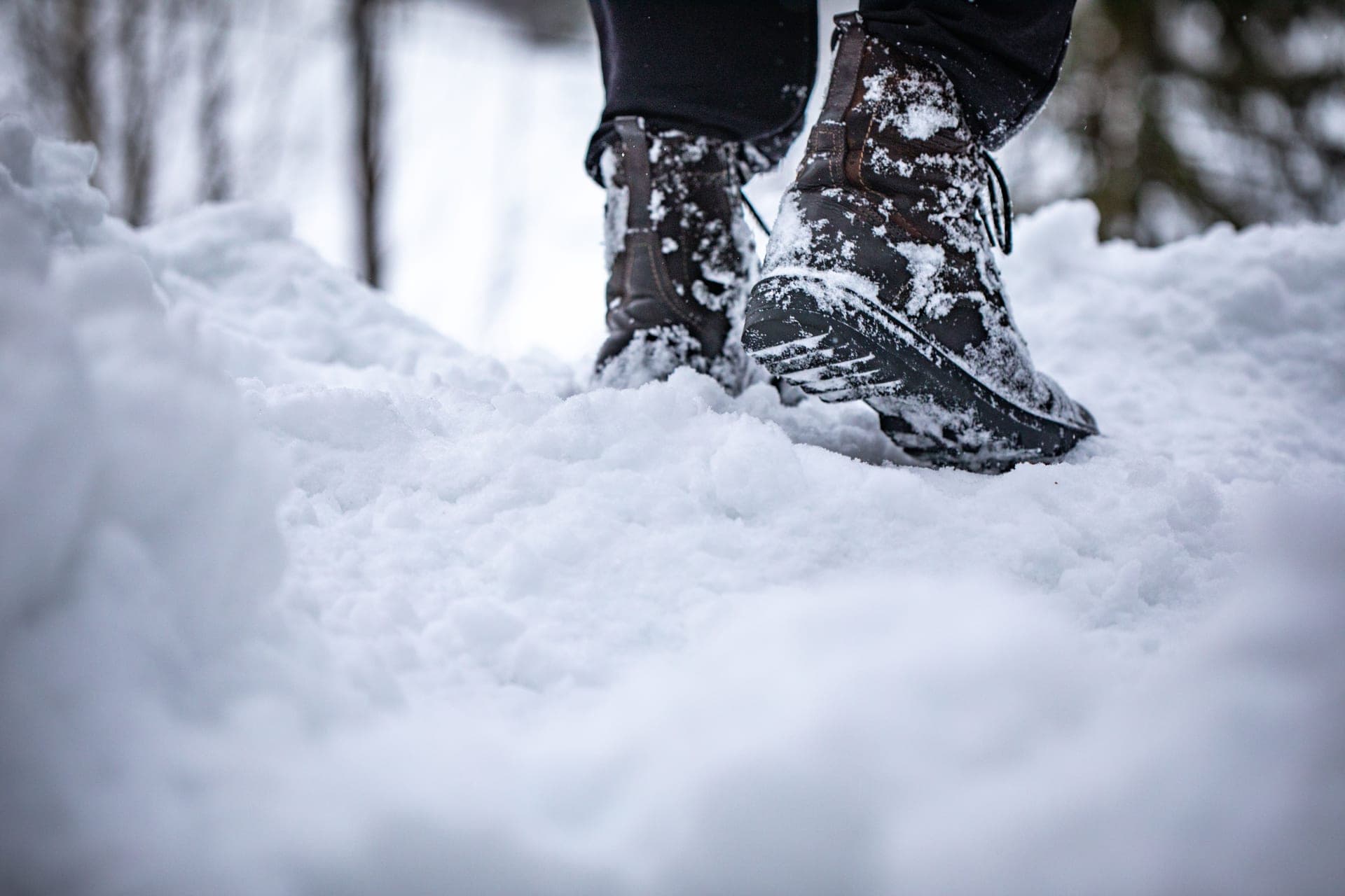 Work boots in snow on a cold outdoor job site